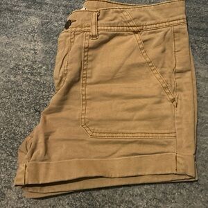 Khaki/tan shorts.